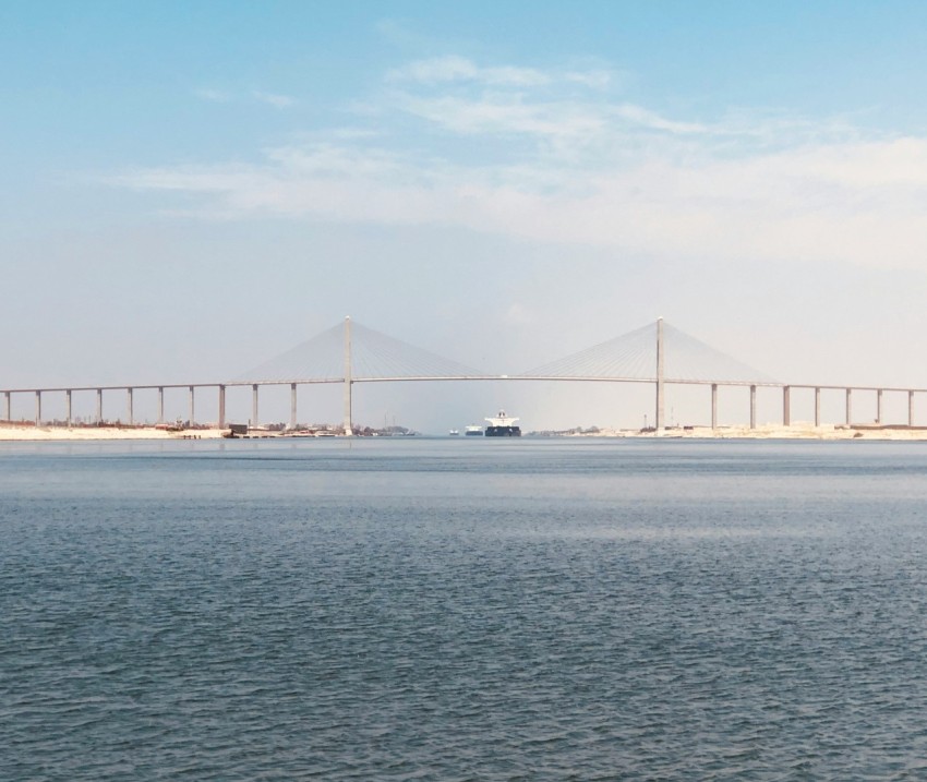 bridge over the sea under blue sky during daytime