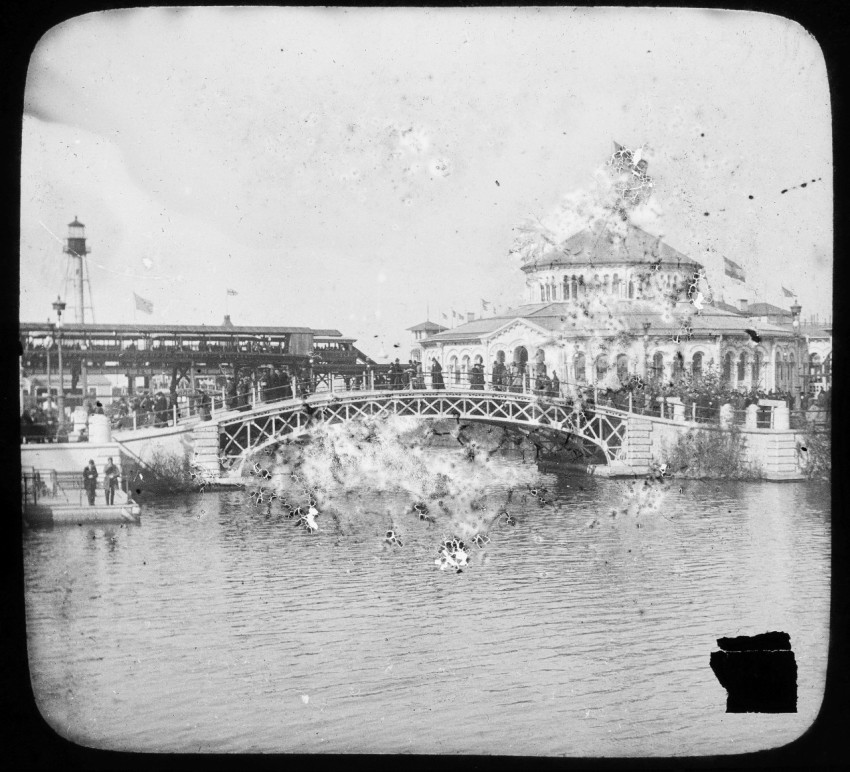 a black and white photo of a bridge over a river