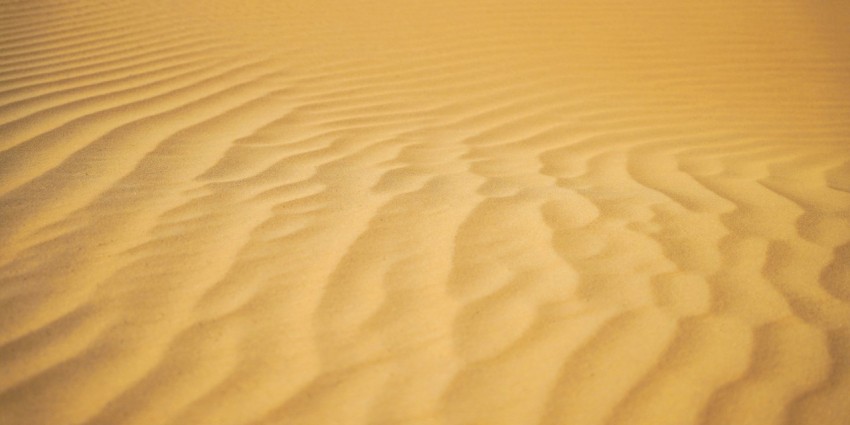a sandy area with a few lines in the sand
