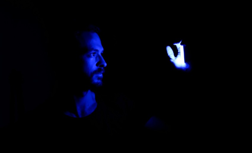 man in black shirt with blue light bcv1