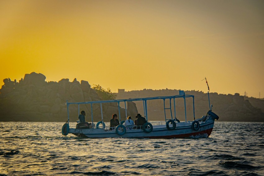 a group of people riding on the back of a boat