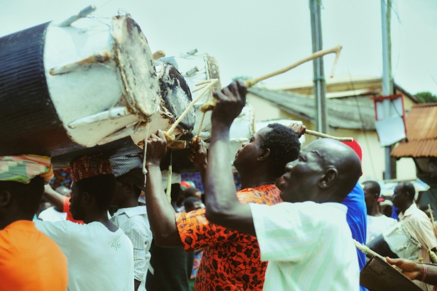 a group of people standing around each other