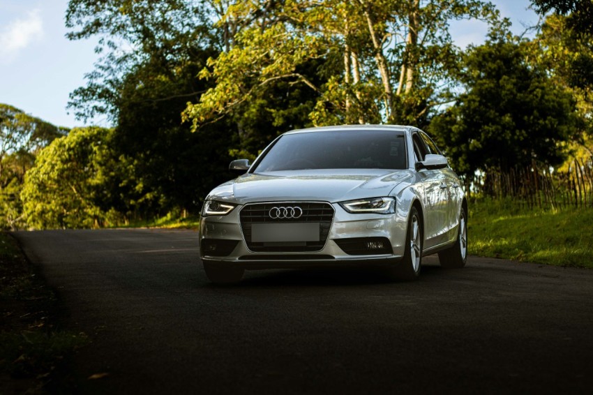 a silver car parked on the side of a road