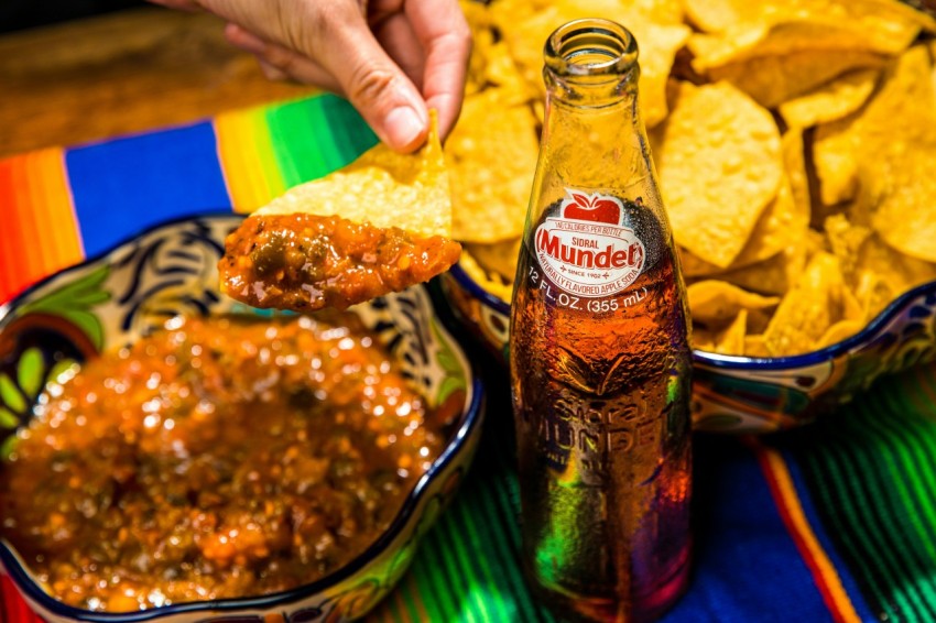 coca cola bottle beside bread on green ceramic plate