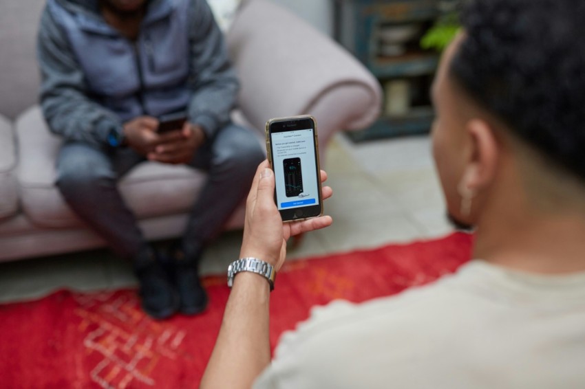 a person looking at blood glucose results