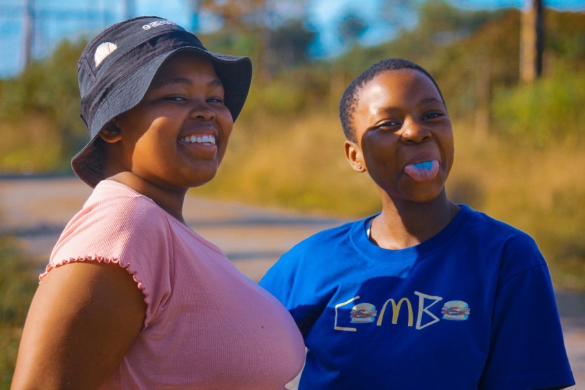a couple of women standing next to each other