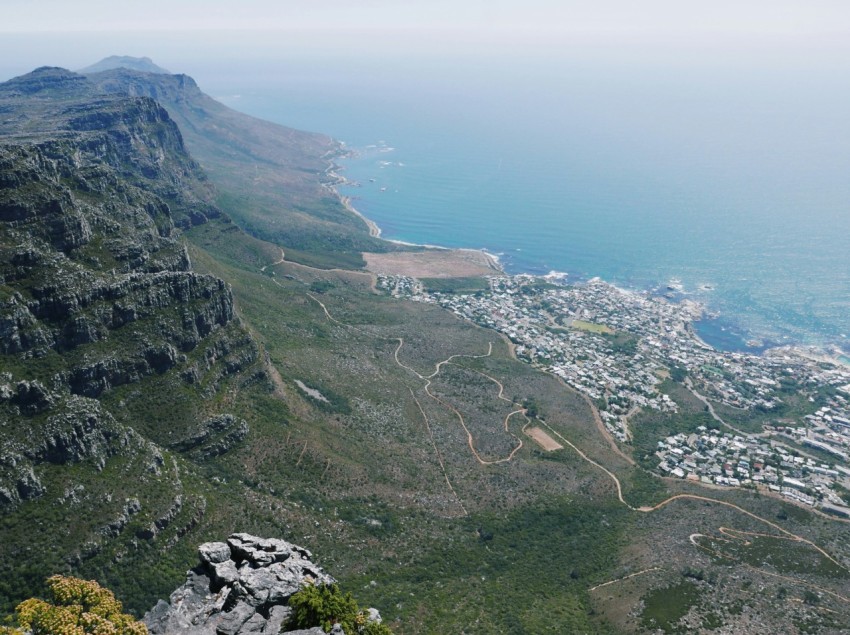 a scenic view of a city and the ocean