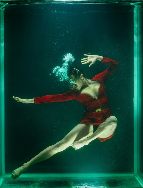 woman in red bikini under water