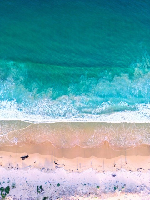 a wave crashing on a beach