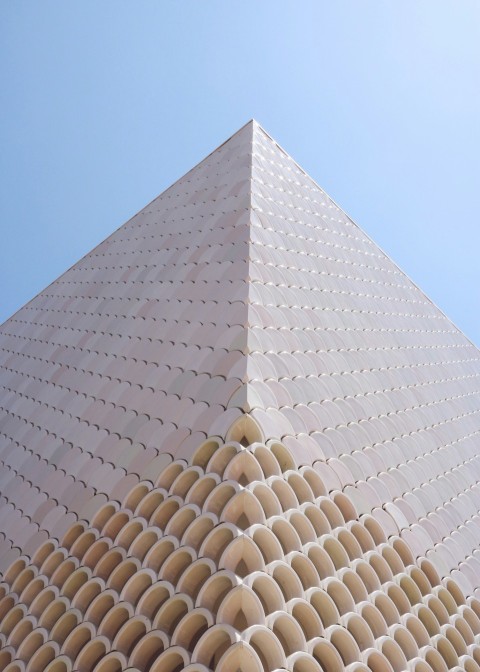 low angle photography of beige building