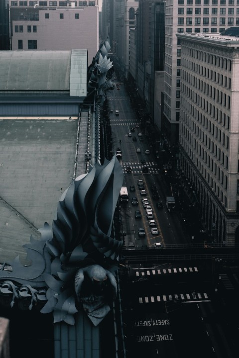 a city street with a large statue BNxe