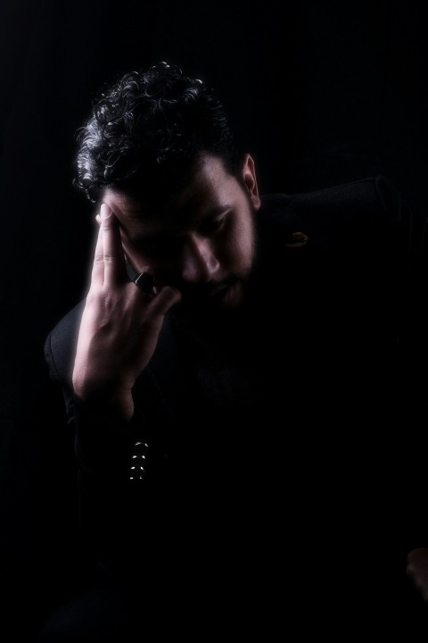 a man holding his face N8q 3 G4