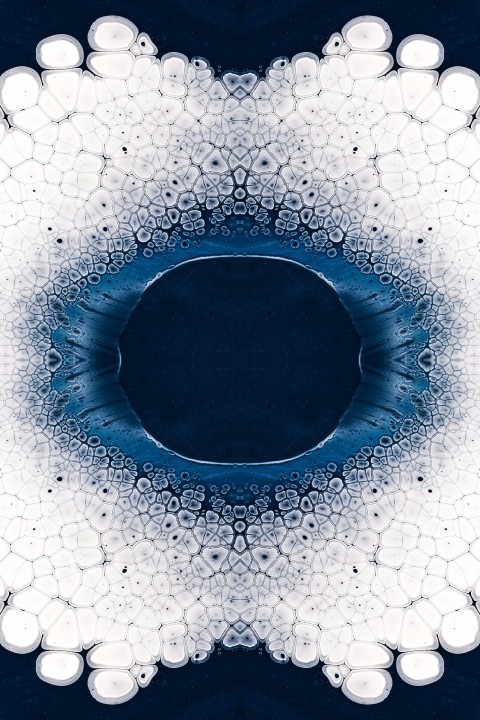 a blue and white circular design with bubbles