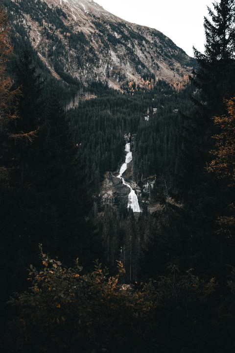 a scenic view of a mountain with a river running through it 85KTMPNy
