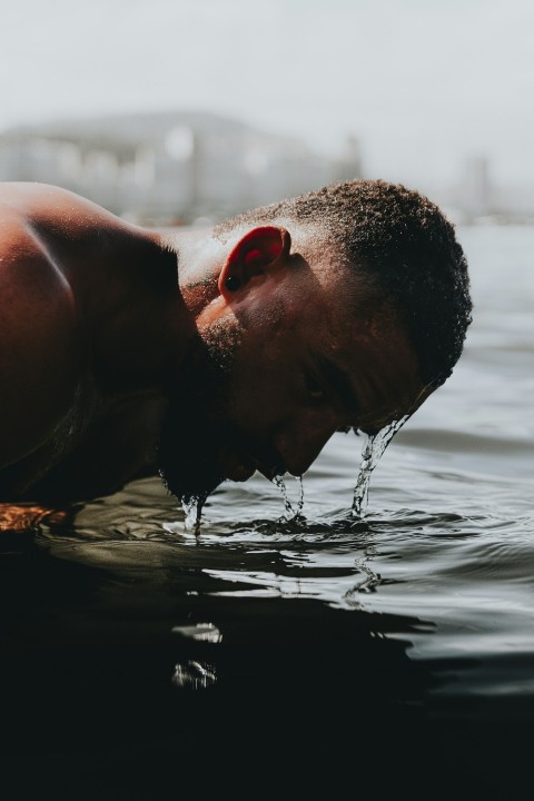 man in water during daytime vR04d