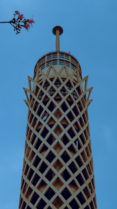 a very tall tower with a clock on its side
