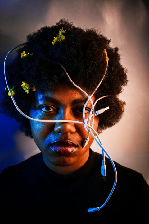 man in black crew neck shirt with white earbuds